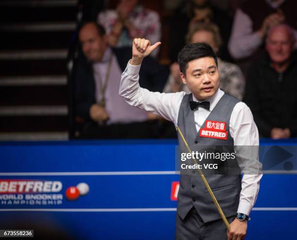 Ding Junhui of China reacts during his quarter final match against Ronnie O'Sullivan of England on day twelve of Betfred World Championship 2017 at...