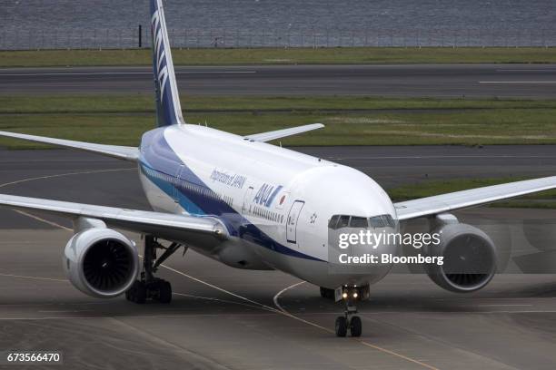 An All Nippon Airways Co. Aircraft taxis at Haneda Airport in Tokyo, Japan, on Wednesday, April 26, 2017. ANA is scheduled to release Fourth-quarter...