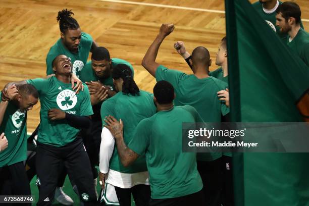 From left, Avery Bradley, Terry Rozier, James Young, and Marcus Smart of the Boston Celtics celebrate with teammates before the start of Game Five of...
