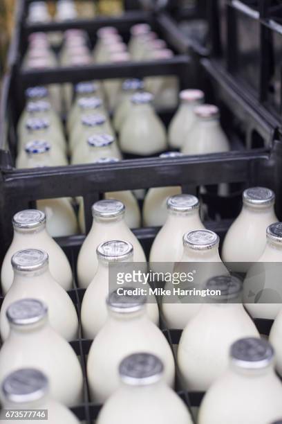 close up of milk bottles in a milk float - milk bottle foto e immagini stock