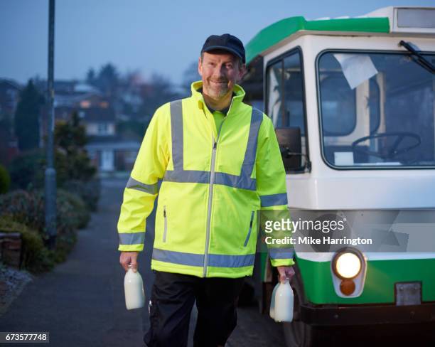 portrait of milkman during early morning shift - milkman stock pictures, royalty-free photos & images
