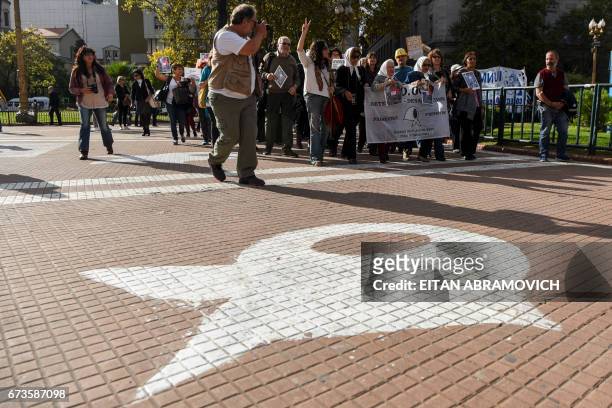 Members of the Argentine human rights group "Madres de Plaza de Mayo" Taty Almeida , Nora Cortinas and Mirta Acuna de Baravalle take part in the...