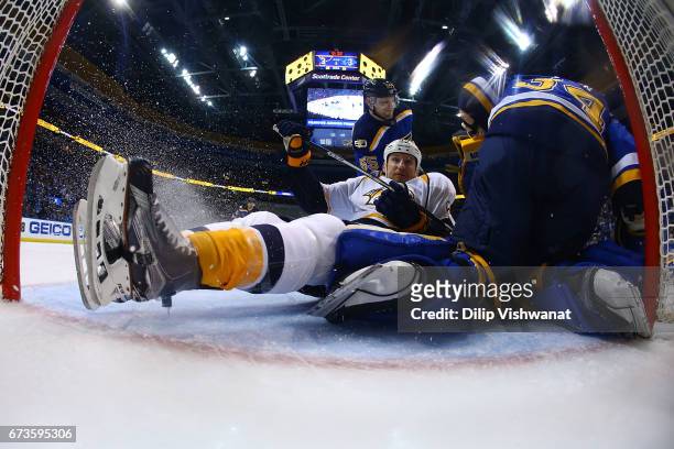 Cody McLeod of the Nashville Predators crashes into the goal against the St. Louis Blues in Game One of the Western Conference Second Round during...