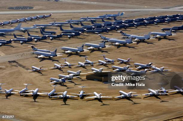 Commercial airliners sit at the Southern California Logistics Airport November 26, 2001 in Victorville, California. With business down, major...