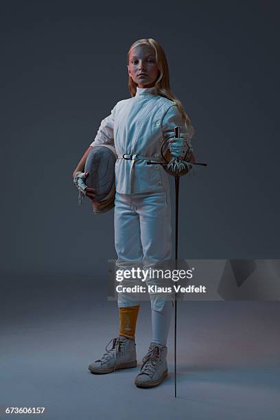 portrait of young fencer looking to camera - mädchen cool stock-fotos und bilder