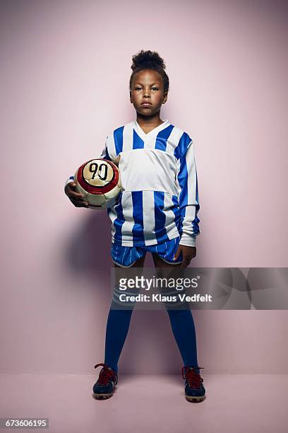 portrait of cool young female football player - childs pose fotografías e imágenes de stock