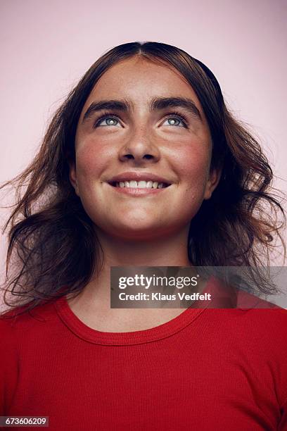 portrait of beautiful girl looking up and smiling - youth portrait foto e immagini stock