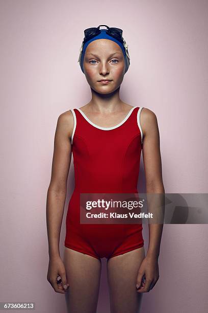 portrait of cool young female swimmer - tween girl swimsuit stockfoto's en -beelden