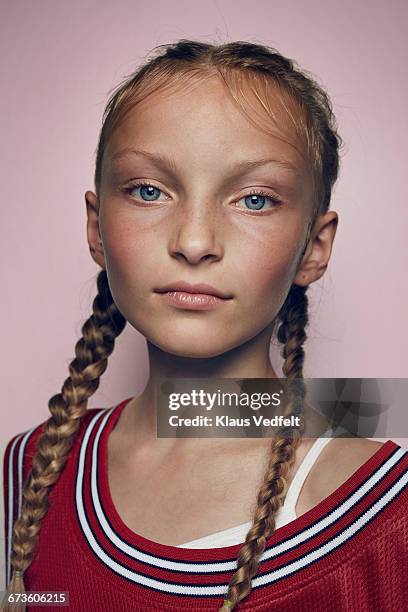 portrait of cool young female basketball player - child portrait studio stock-fotos und bilder