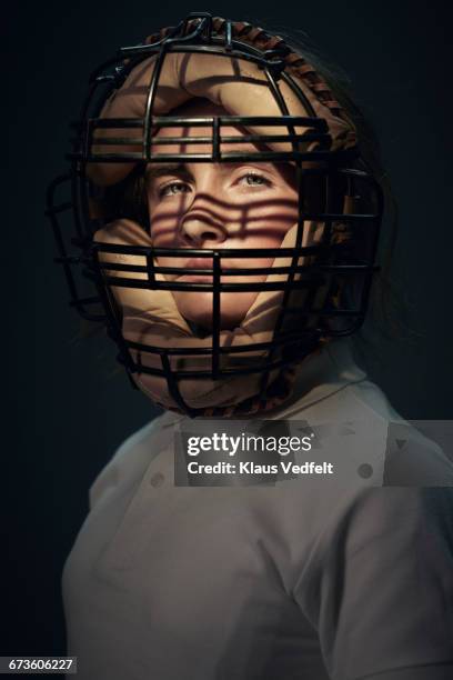 portrait of girl wearing vintage baseball mask - baseball player headshot stock-fotos und bilder