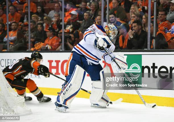 Edmonton Oilers Goalie Cam Talbot plays the puck in the trapezoid during game 1 of the second round of the 2017 NHL Stanley Cup Playoffs between the...