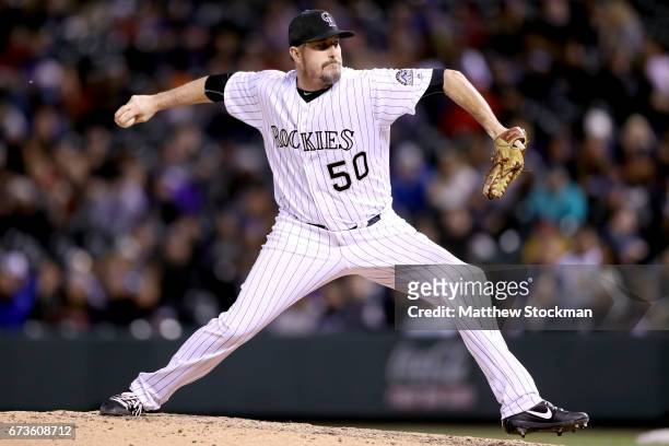 Chad Qualls of the Colorado Rockies throws in the seventh inning against the Washington Nationals at Coors Field on April 26, 2017 in Denver,...