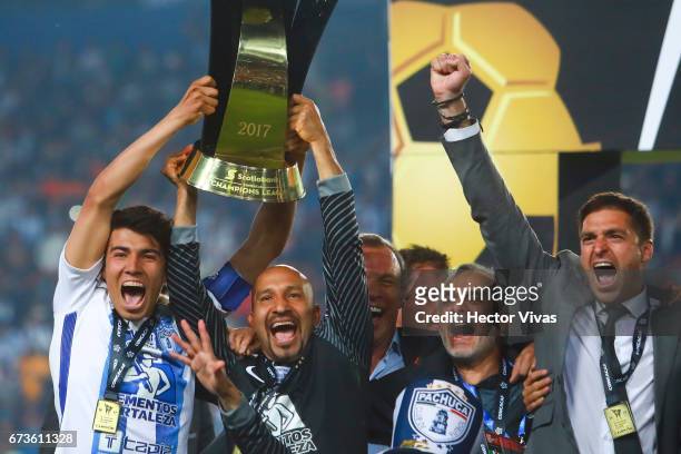 Erick Gutierrez, Oscar Perez, Jesus Martinez and Diego Alonso of Pachuca celebrate with the trophy after winning the Final second leg match between...