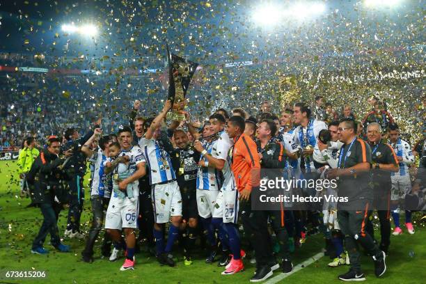 Erick Gutierrez of Pachuca lifts the trophy to celebrate with teammates after winning the Final second leg match between Pachuca and Tigres UANL as...