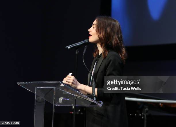 Actress Lily Collins speaks onstage at We Day California 2017 Cocktail Reception at NeueHouse Hollywood on April 26, 2017 in Los Angeles, California.