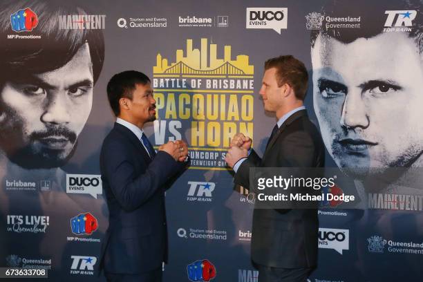 Boxers Manny Pacquiao of the Philippines and Jeff Horn of Australia pose for the media during a press conference at Invictus Gym on April 27, 2017 in...