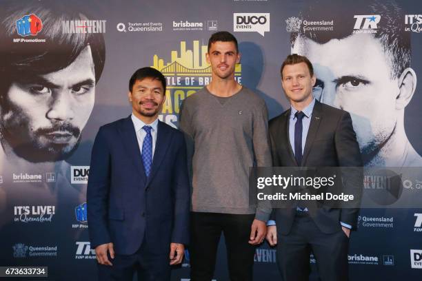 Boxers Manny Pacquiao of the Philippines and Jeff Horn of Australia pose for the media with AFL Player Scott Pendlebury of the Collingwood Magpies...