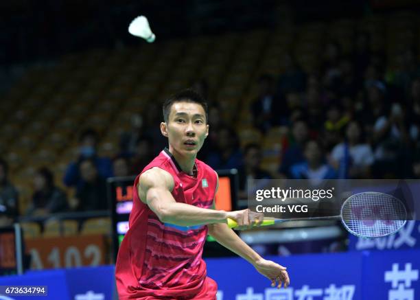 Lee Chong Wei of Malaysia returns to Kenta Nishimoto of Japan during 2017 Badminton Asia Championships men's singles second round match at Wuhan...