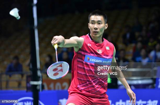 Lee Chong Wei of Malaysia returns to Kenta Nishimoto of Japan during 2017 Badminton Asia Championships men's singles second round match at Wuhan...