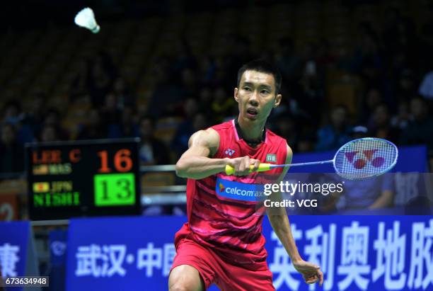 Lee Chong Wei of Malaysia returns to Kenta Nishimoto of Japan during 2017 Badminton Asia Championships men's singles second round match at Wuhan...