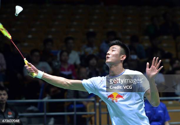 Chen Long of China returns to Takuma Ueda of Japan during 2017 Badminton Asia Championships men's singles second round match at Wuhan Sports Center...