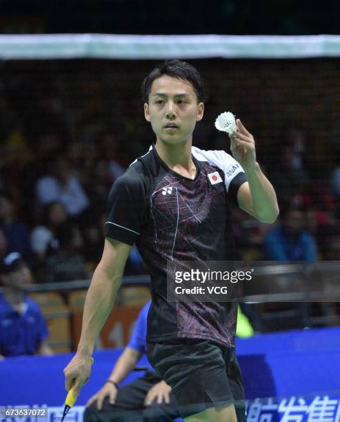 Takuma Ueda of Japan reacts during 2017 Badminton Asia Championships men's singles second round match against Chen Long of China at Wuhan Sports...