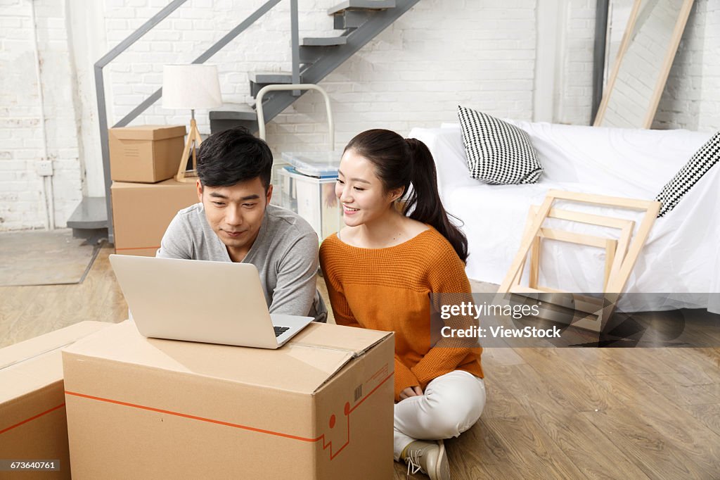 Young couples use notebook computers
