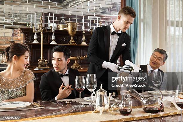 aristocratic family dinner - country club dinner stock pictures, royalty-free photos & images