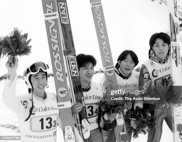 Silver medalists Masahiko Harada, Hiroya Saito, Takanobu Okabe and Kazuyoshi Funaki of Japan celebrate at the medal ceremony for Ski Jumping Team...