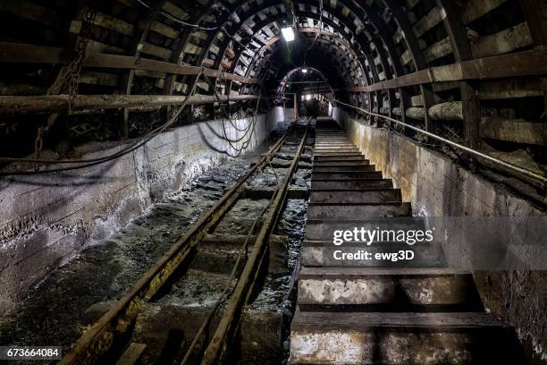 coal mine underground corridor with stairs and railroad track - anthracite coal stock pictures, royalty-free photos & images