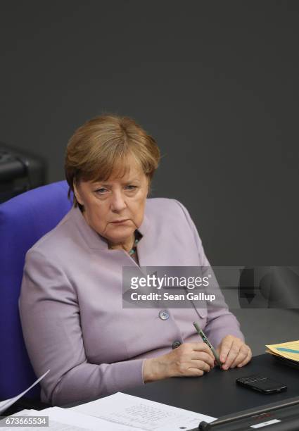 German Chancellor Angela Merkel attends debates after she gave a government declaration outlining Germany's position on negotiations over the United...