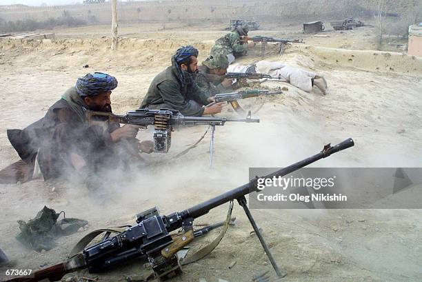 Northern Alliance fighters battle pro-Taliban forces November 27, 2001 in a fortress near Mazar-e-Sharif, Afghanistan. The Northern Alliance, helped...