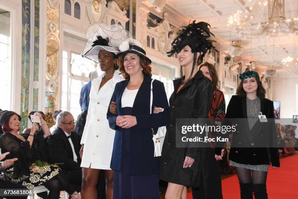 Hatter Marie Mirabelle Desnos and her models walk the runway during "Fashion Night Couture 2017" Show at Salon des Miroirs on April 26, 2017 in...