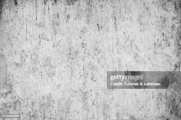 weathered, faded and peeled off concrete wall texture background with some vignetting. - chipping stock pictures, royalty-free photos & images