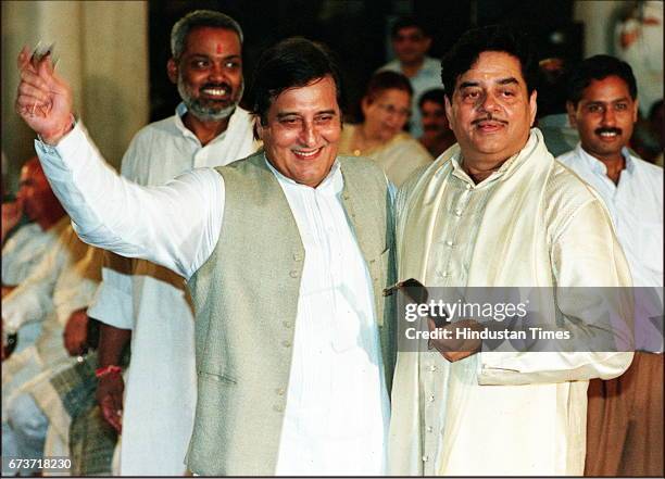 Bollywood actors-turned-politicians Shatrughan Sinha and Vinod Khanna after taking oath for the Union Ministry during a swearing-in ceremony at...