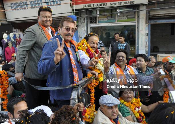 Bollywood actor and Member of Parliament Vinod Khanna with BJP CM Candidate Harshvardan during a road show in Krishna Nagar for Delhi Assembly...