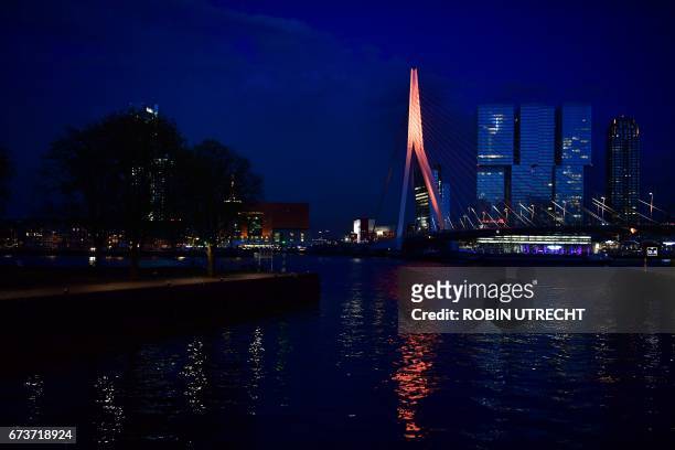 The Erasmusbrug colours orange in Rotterdam on April 26 2017, on the eve of King Willem-Alexanders 50th birthday, celebrated during the traditional...