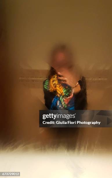 woman taking selfie in a mirror - mirror steam stockfoto's en -beelden
