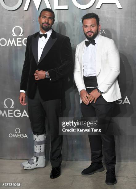 David Haye and Joe Fournier attend the Lost In Space event to celebrate the 60th anniversary of the OMEGA Speedmaster at the Tate Modern on April 26,...