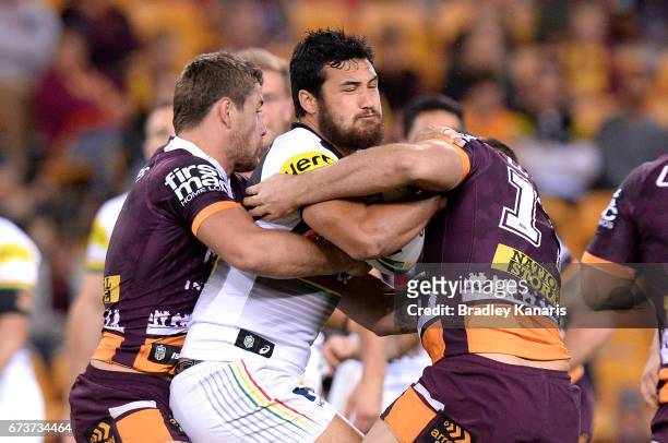 Peta Hiku of the Panthers is tackled during the round nine NRL match between the Brisbane Broncos and the Penrith Panthers at Suncorp Stadium on...