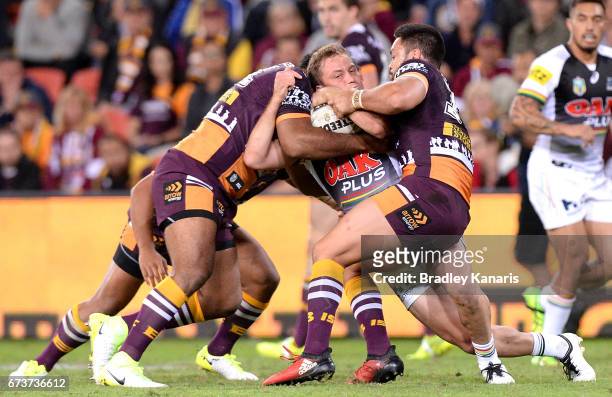 Matt Moylan of the Panthers is wrapped up by the defence during the round nine NRL match between the Brisbane Broncos and the Penrith Panthers at...