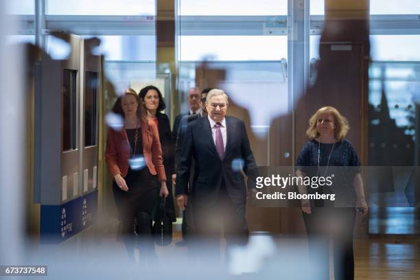 George Soros, billionaire and founder of Soros Fund Management LLC, center, arrives ahead of a meeting with the President of the European Commission...