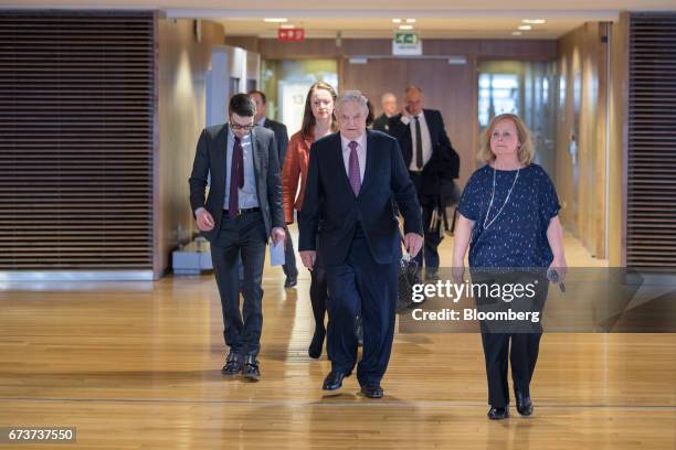 George Soros, billionaire and founder of Soros Fund Management LLC, center, arrives ahead of a meeting with the President of the European Commission...