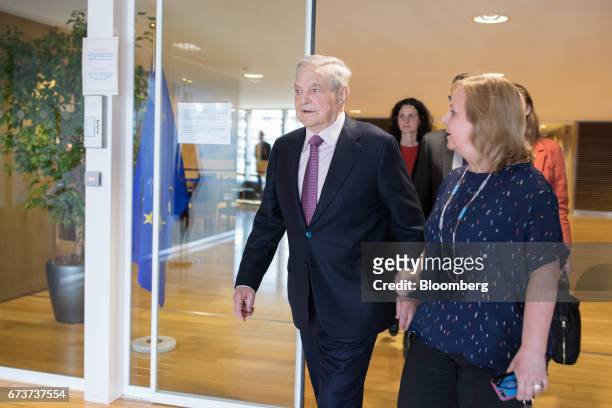 George Soros, billionaire and founder of Soros Fund Management LLC, center, arrives ahead of a meeting with the President of the European Commission...