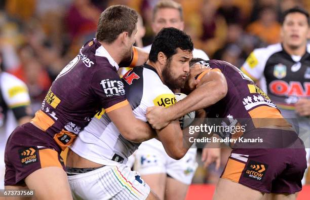 Peta Hiku of the Panthers is wrapped by the defence during the round nine NRL match between the Brisbane Broncos and the Penrith Panthers at Suncorp...