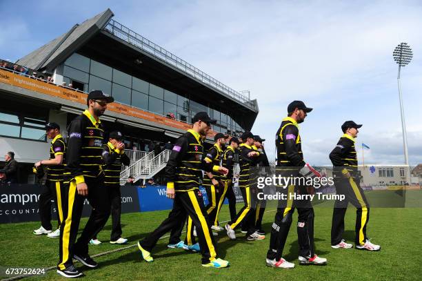 The Gloucestershire side walk out to field during the Royal London One-Day Cup between Gloucestershire and Glamorgan at The Brightside Ground on...