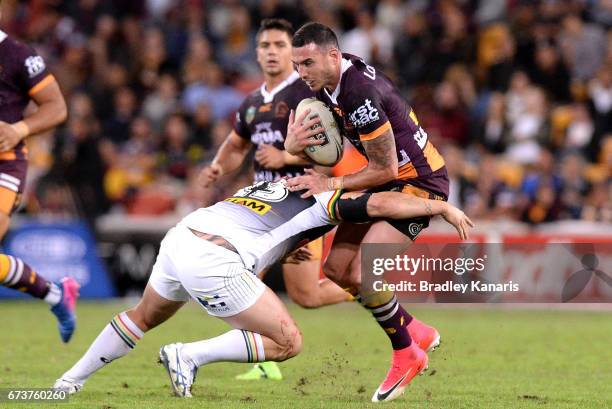Darius Boyd of the Broncos is tackled during the round nine NRL match between the Brisbane Broncos and the Penrith Panthers at Suncorp Stadium on...