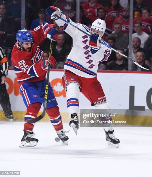 Andrew Shaw of the Montreal Canadiens collides with Chris Kreider of the New York Rangers in Game Five of the Eastern Conference Quarterfinals during...