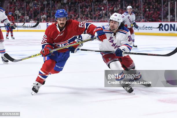 Andrew Shaw of the Montreal Canadiens skates against Mats Zuccarello of the New York Rangers in Game Five of the Eastern Conference Quarterfinals...