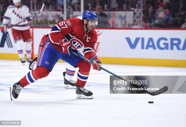 Max Pacioretty of the Montreal Canadiens skates with the puck against the New York Rangers in Game Five of the Eastern Conference Quarterfinals...
